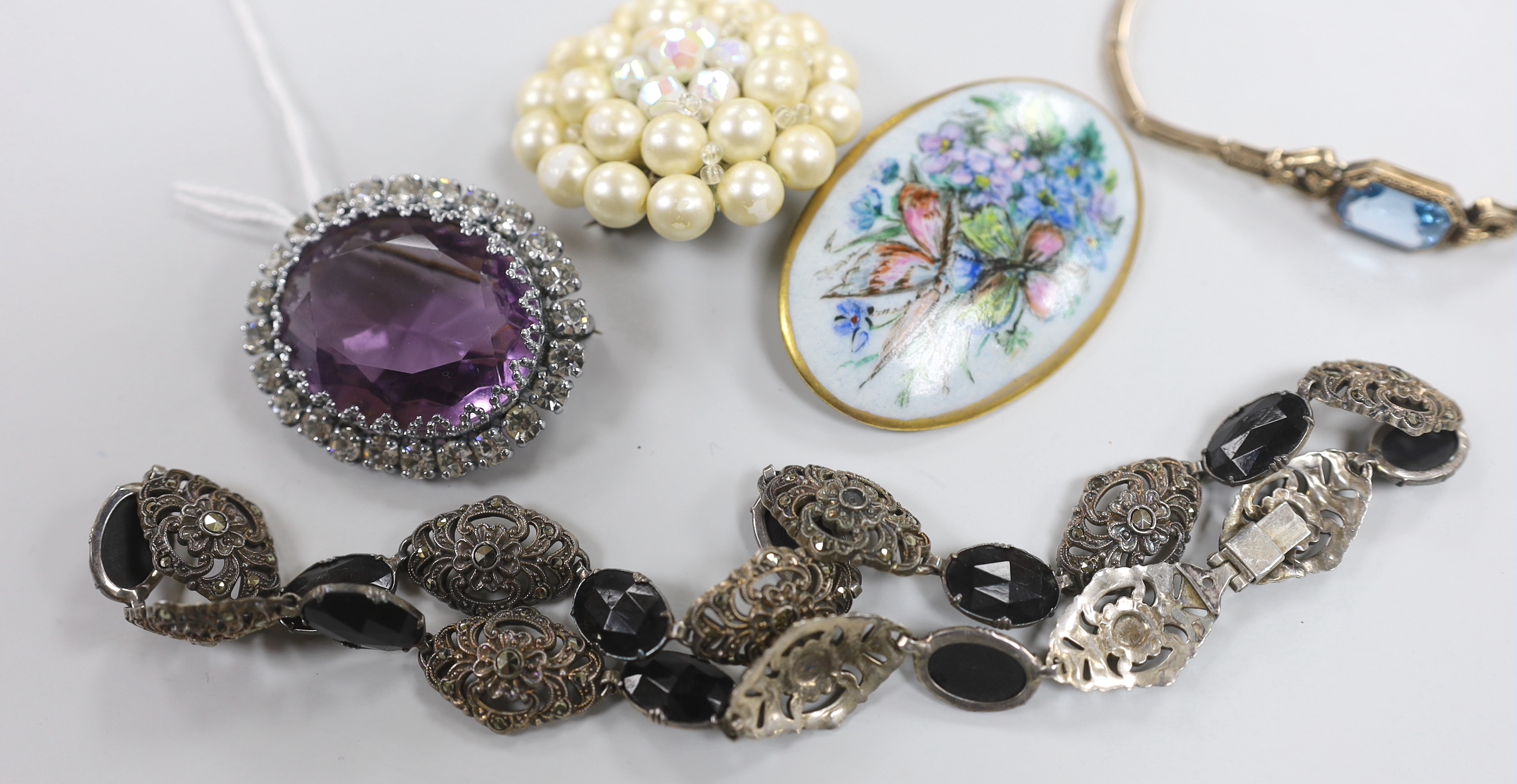 A small group of assorted costume jewellery including marcasite necklace, amethyst paste brooch, bracelet etc.